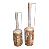 Home Sajawat set of two antique gold metal lanterns with white distressed necks and perforated cylindrical bases. Features handles.