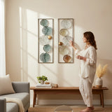 Home Sajawat set of two metal lily pad wall art panels in teal, silver, gold, and copper tones with openwork design.