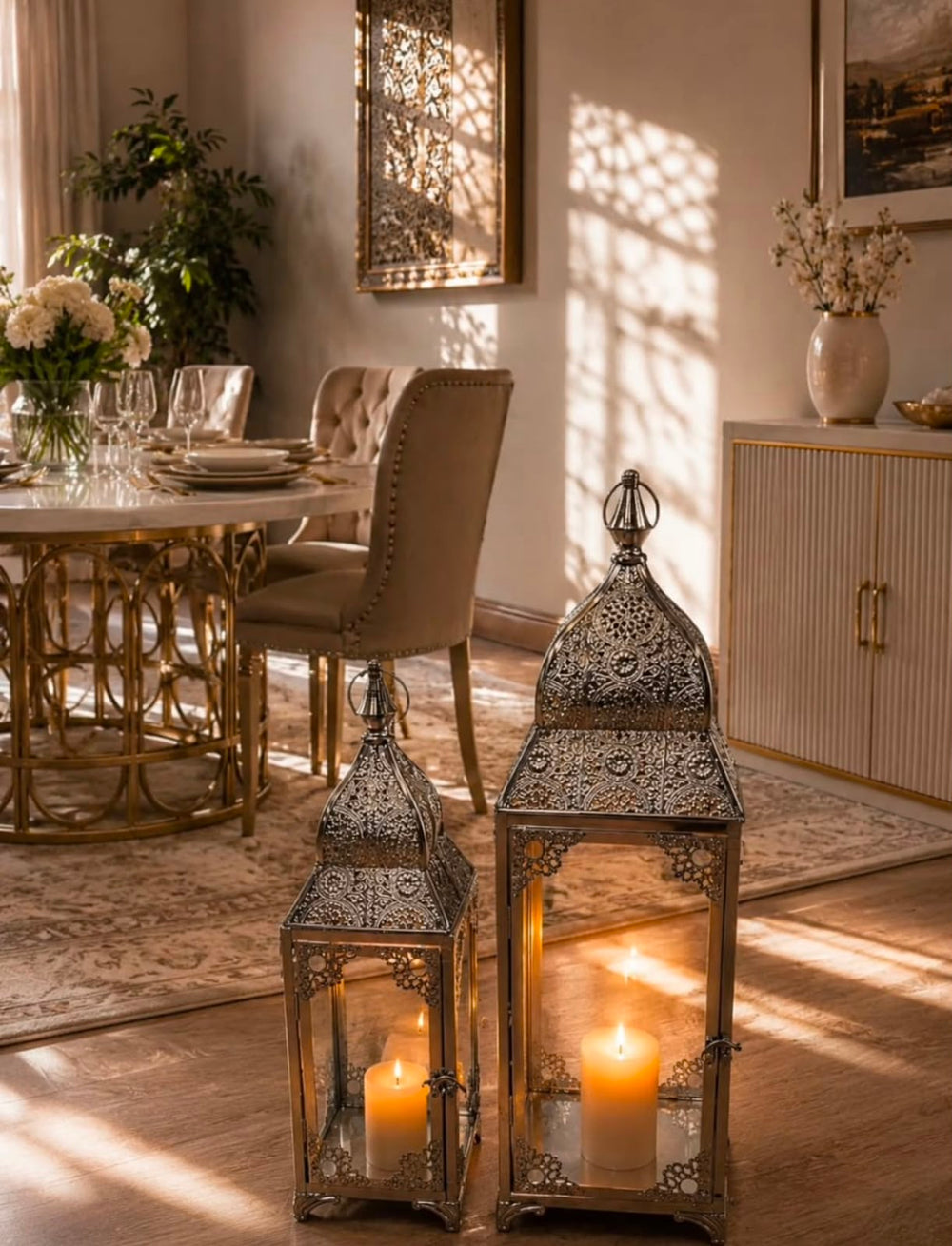 Home Sajawat set of two ornate Moroccan-style metal lanterns with intricate filigree patterns and glowing candles