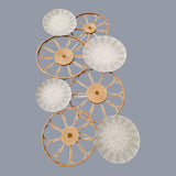 Home Sajawat set of four decorative wall plates with woven rattan frames and embossed botanical motifs in neutral tones.