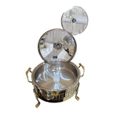 Home Sajawat decorative stainless steel chafing dish with gold Greek key pattern and glass lid, ideal for serving.