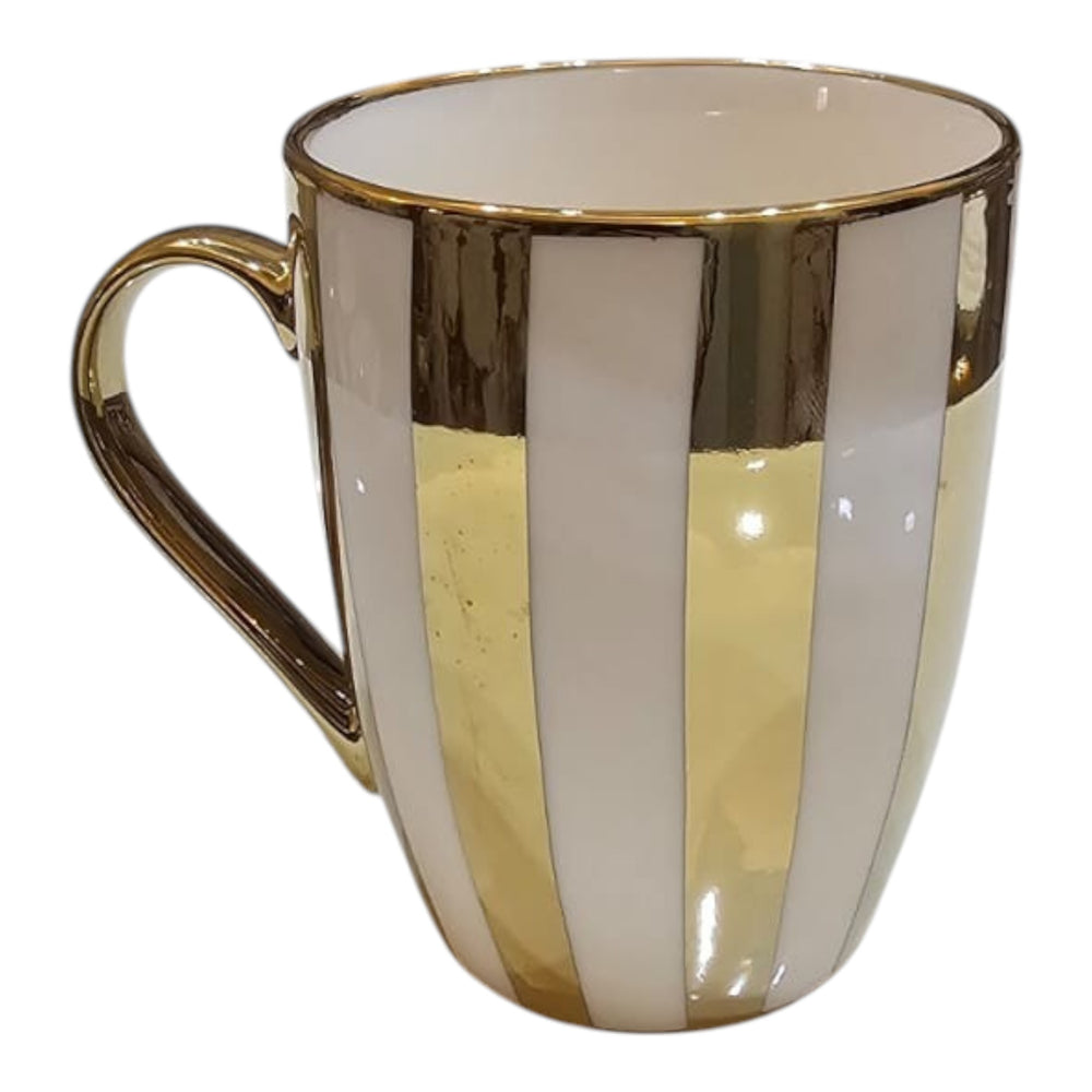 Home Sajawat ceramic coffee mug with white and metallic gold vertical stripes and a gold handle on a white tray.