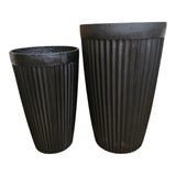 Home Sajawat tall faux potted plant in a ribbed black planter. Realistic green leaves and branches add natural beauty without maintenance.