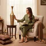 Home Sajawat tall gold hammered metal floor vase with textured cylindrical base and flared neck.