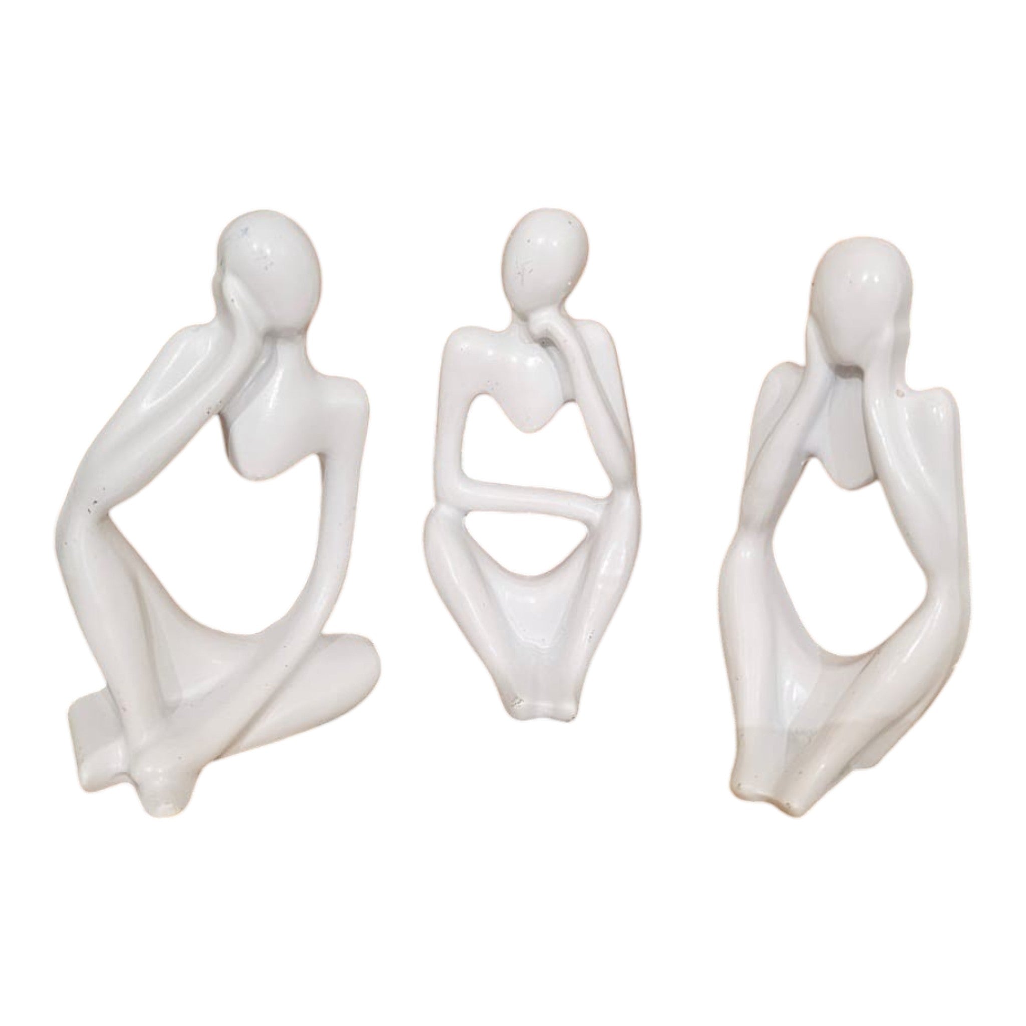 Home Sajawat set of three white abstract thinker figurines with smooth minimalist silhouettes on a wooden table