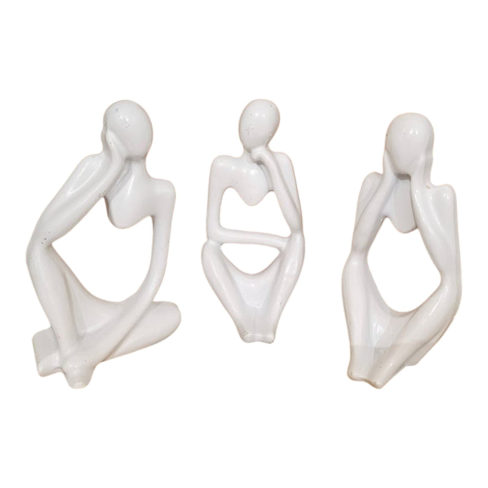 Home Sajawat set of three white abstract thinker figurines with smooth minimalist silhouettes on a wooden table