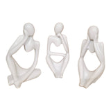 Home Sajawat set of three white abstract thinker figurines with smooth minimalist silhouettes on a wooden table
