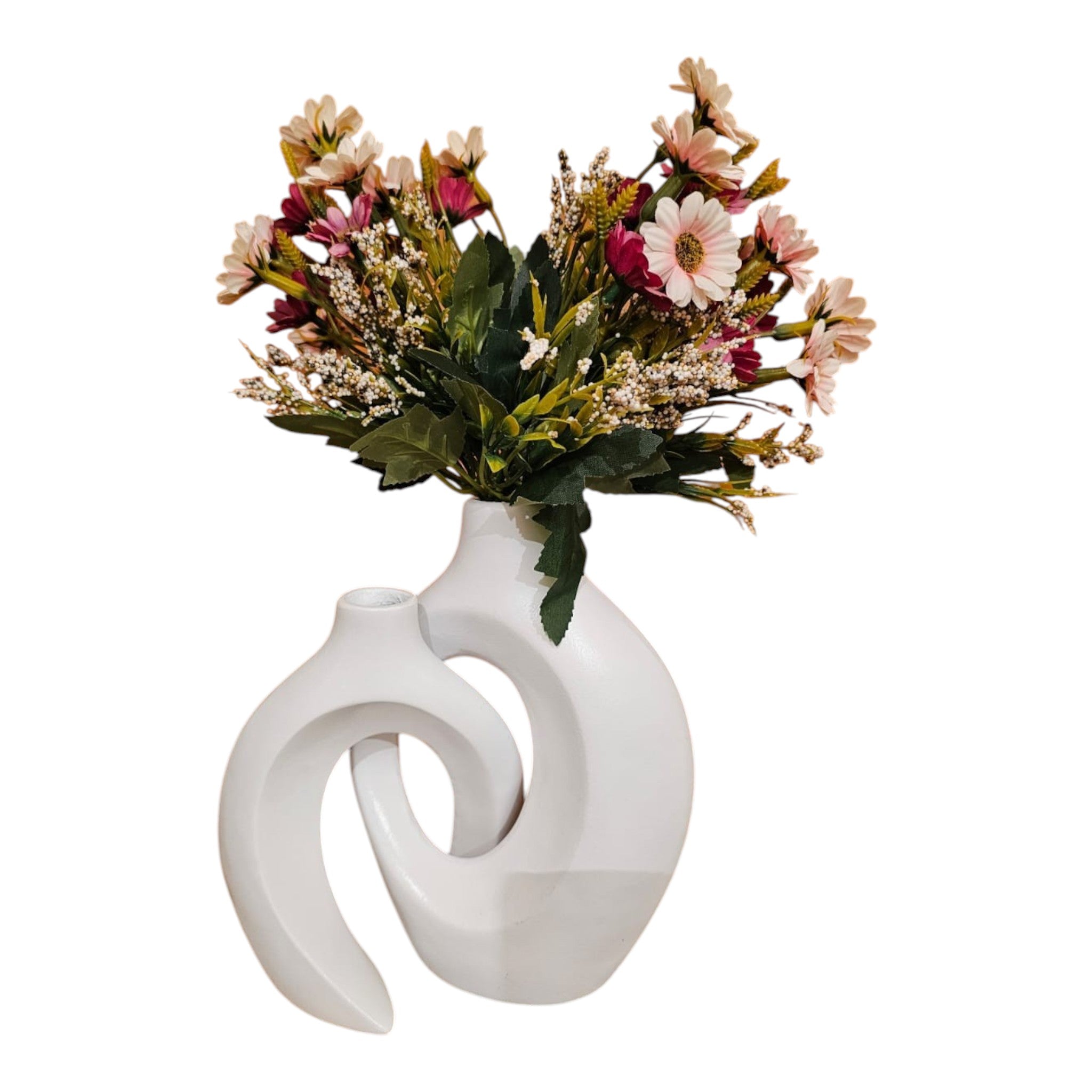 Home Sajawat white ceramic abstract hollow-center vase with a bouquet of colorful faux flowers on a wooden table