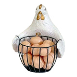 Home Sajawat white chicken-shaped kitchen storage basket with a black metal wire base holding fresh eggs on a countertop