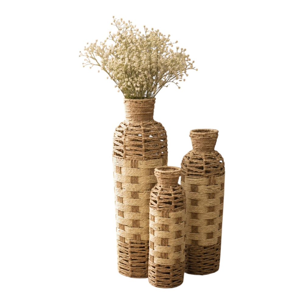 Home Sajawat set of three woven floor vases in tan and off-white natural fiber with a coastal basket-weave design.
