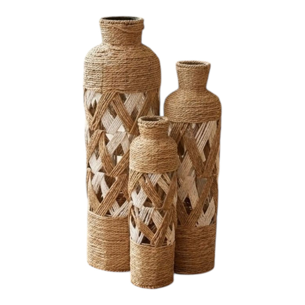 Home Sajawat set of three coastal floor vases in natural jute rope and white woven lattice in a cozy living room.