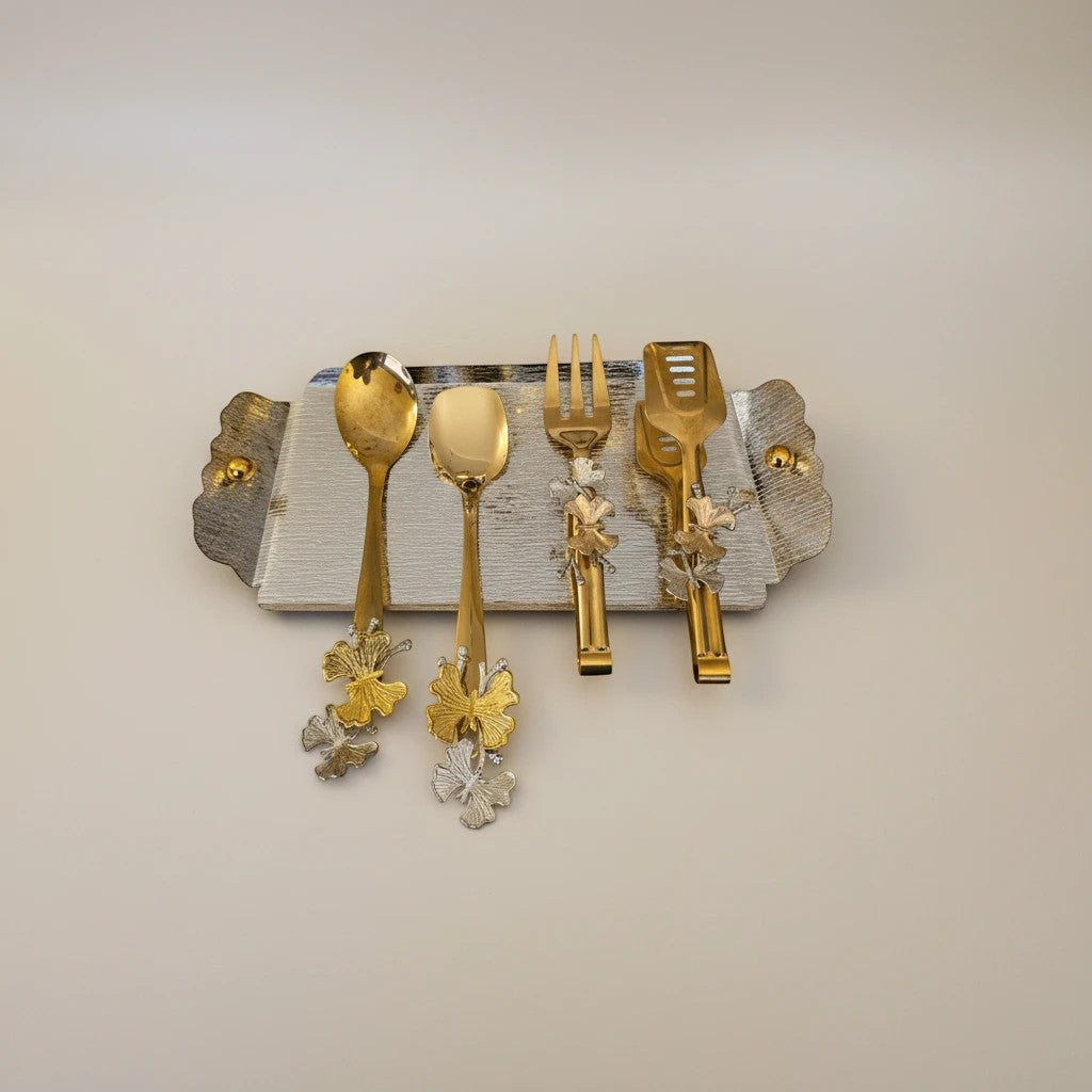 Home Sajawat gold and silver leaf motif serving utensil set with tray. Includes 2 spoons, 1 fork, 1 tong.